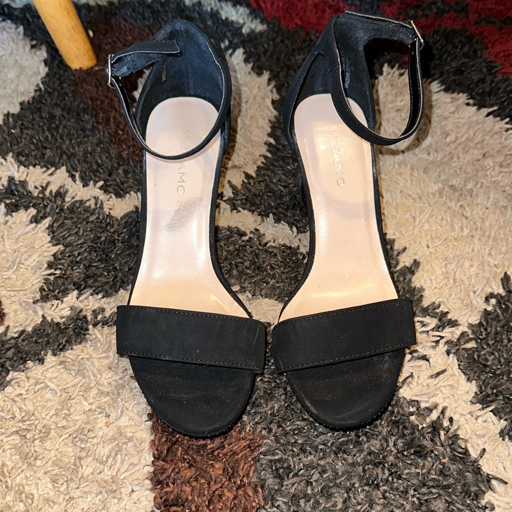 Black 3.5in heels with rhinestone heel and buckle latch. Only worn once